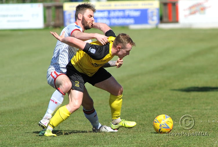 Action from Buckland Athletic’s hard-fought 0-0 draw at home to Tavistock on Good Friday.