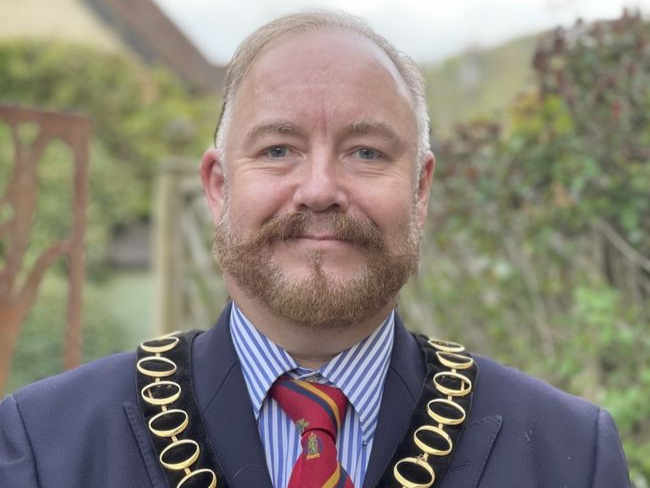 Cllr Adam Carew wearing the East Hampshire District Council chairman’s chain of office, May 2021.