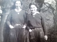 Joyce Elizabeth Gaster (left) driving a caterpillar tractor at Alice Holt Forest and, below, with corps members