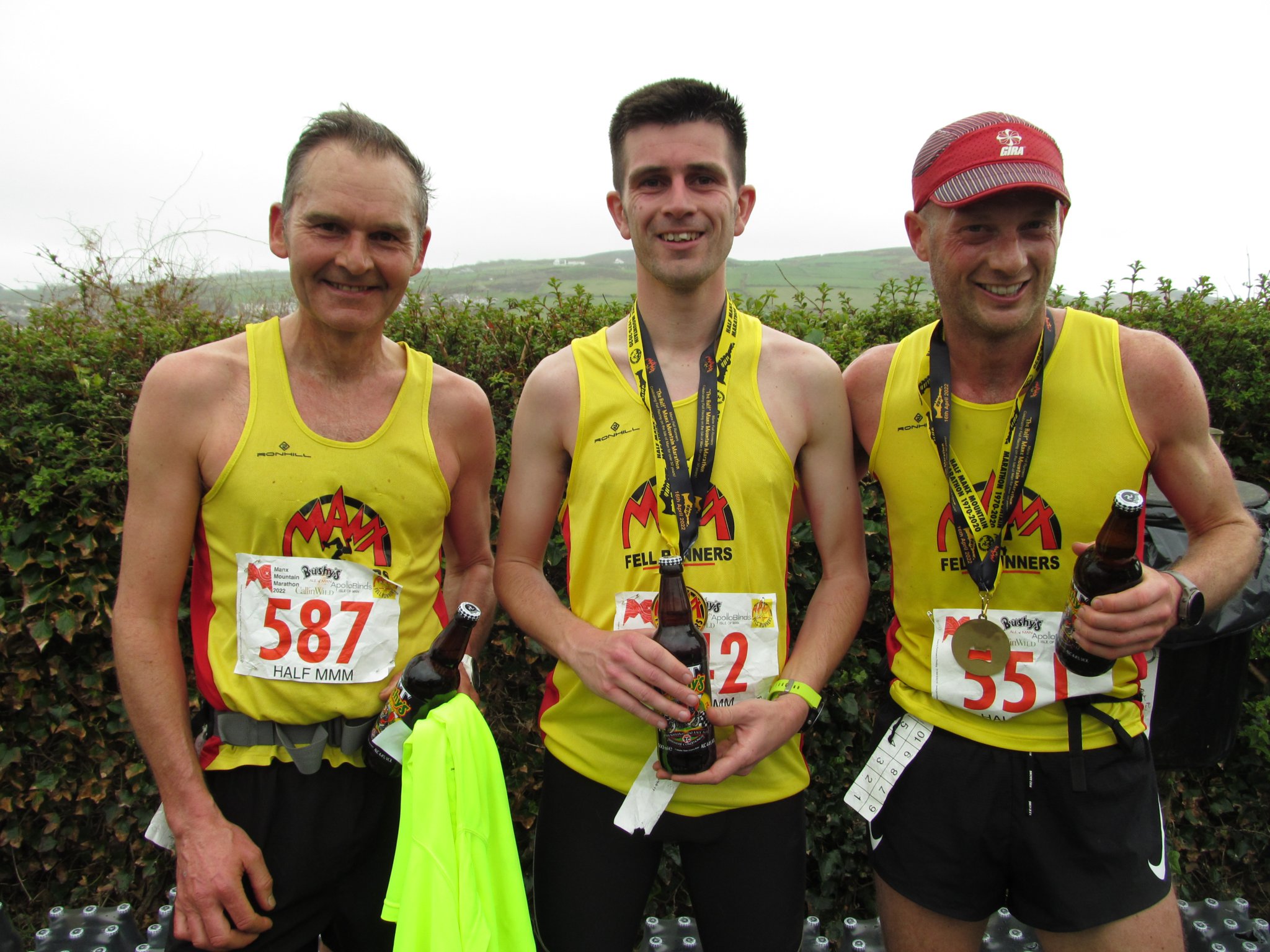 Half Mountain Marathon winner for the second year in succession, Jordan Cain is flanked by runner-up Mark Burman (right) and third-placed man Lloyd Taggart. They enjoyed their bottles of Bushy’s at the finish! (Photo: Phil Cain)