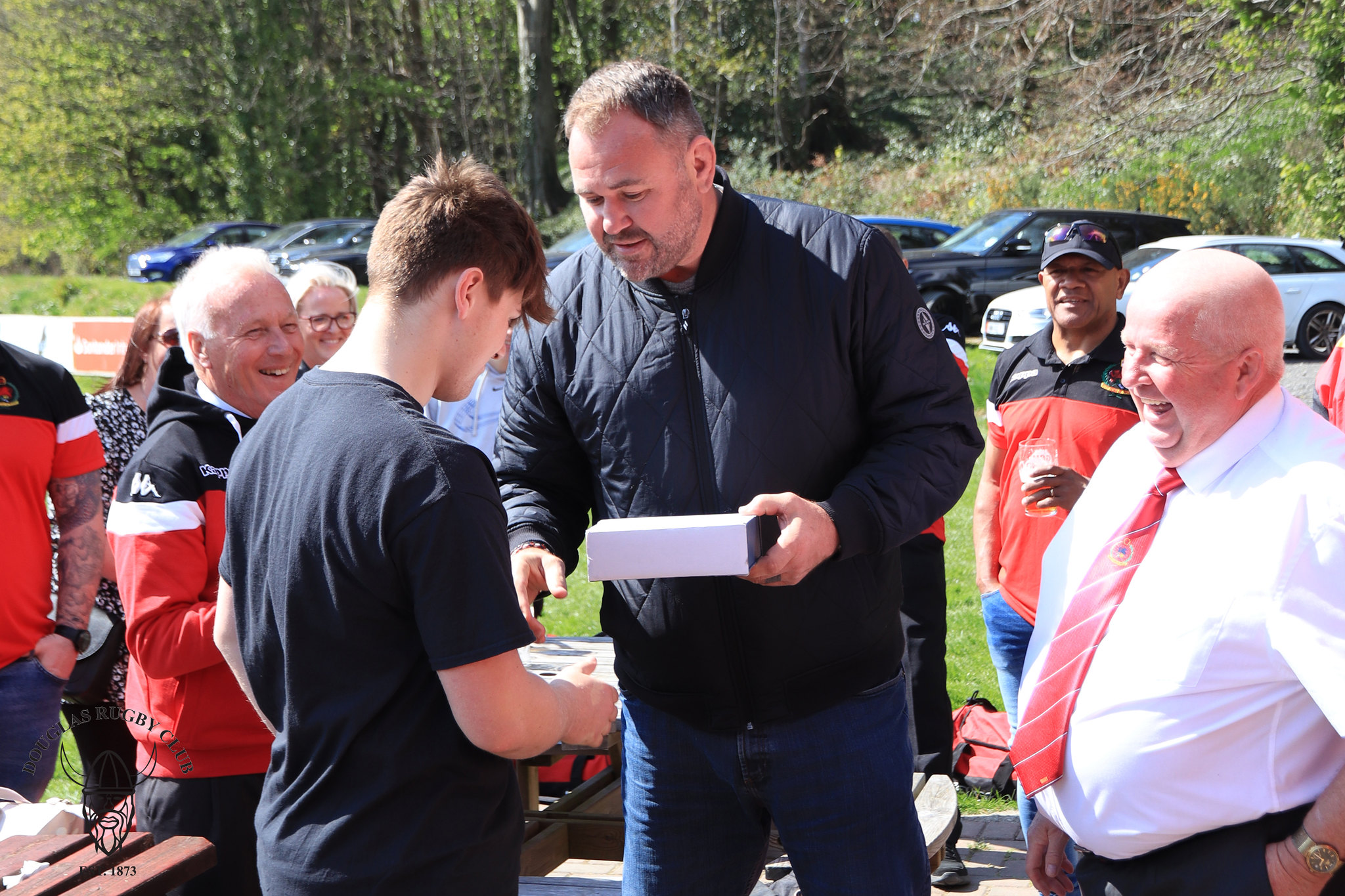 Wales rugby legend Scott Quinnell presents Tom Collister with the under-18 man of the match award on Saturday (Photo: Richard Ebbutt)