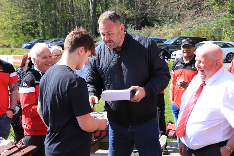 Wales rugby legend Scott Quinnell presents Tom Collister with the under-18 man of the match award on Saturday (Photo: Richard Ebbutt)