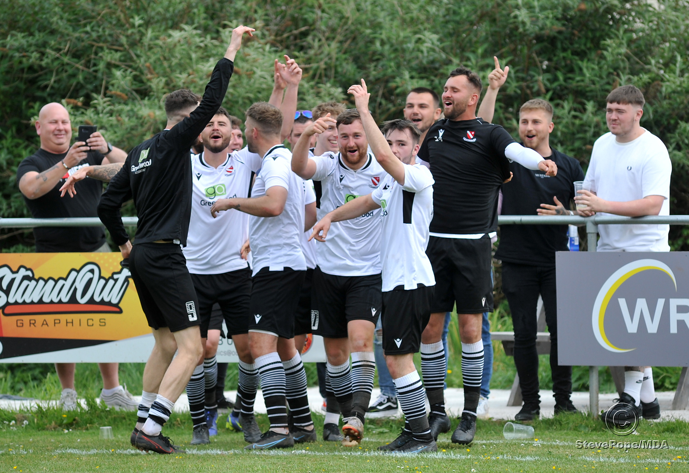 Action from Teignmouth’s clash with Plymstock United on Saturday – which saw the Teigns clinch the Devon Football League South & West title.