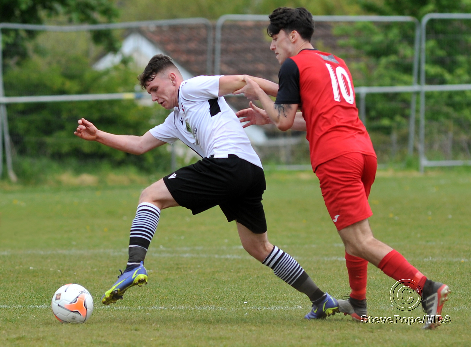 Action from Teignmouth’s clash with Plymstock United on Saturday – which saw the Teigns clinch the Devon Football League South & West title.