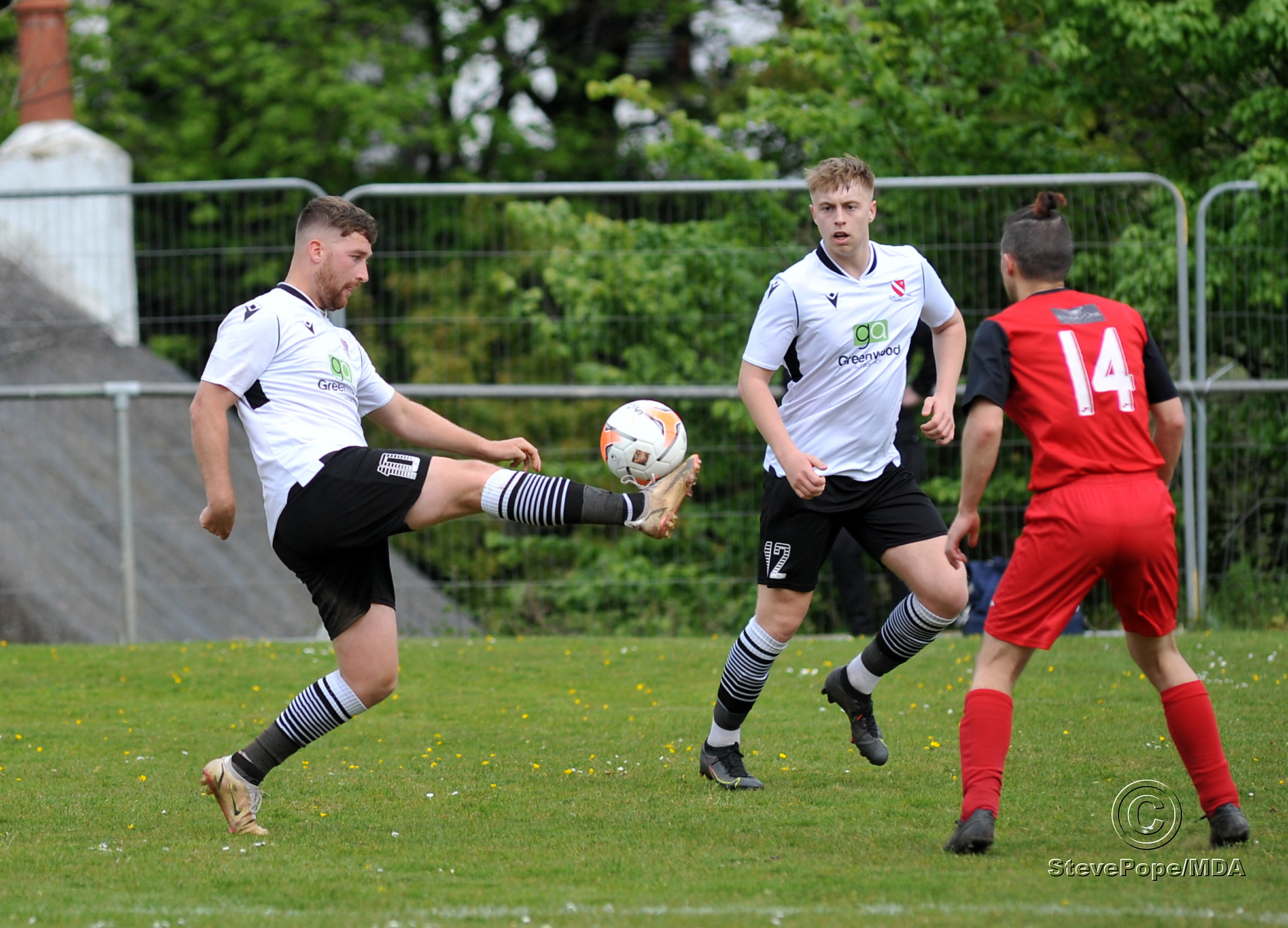 Action from Teignmouth’s clash with Plymstock United on Saturday – which saw the Teigns clinch the Devon Football League South & West title.