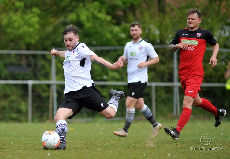 Action from Teignmouth’s clash with Plymstock United on Saturday – which saw the Teigns clinch the Devon Football League South & West title.