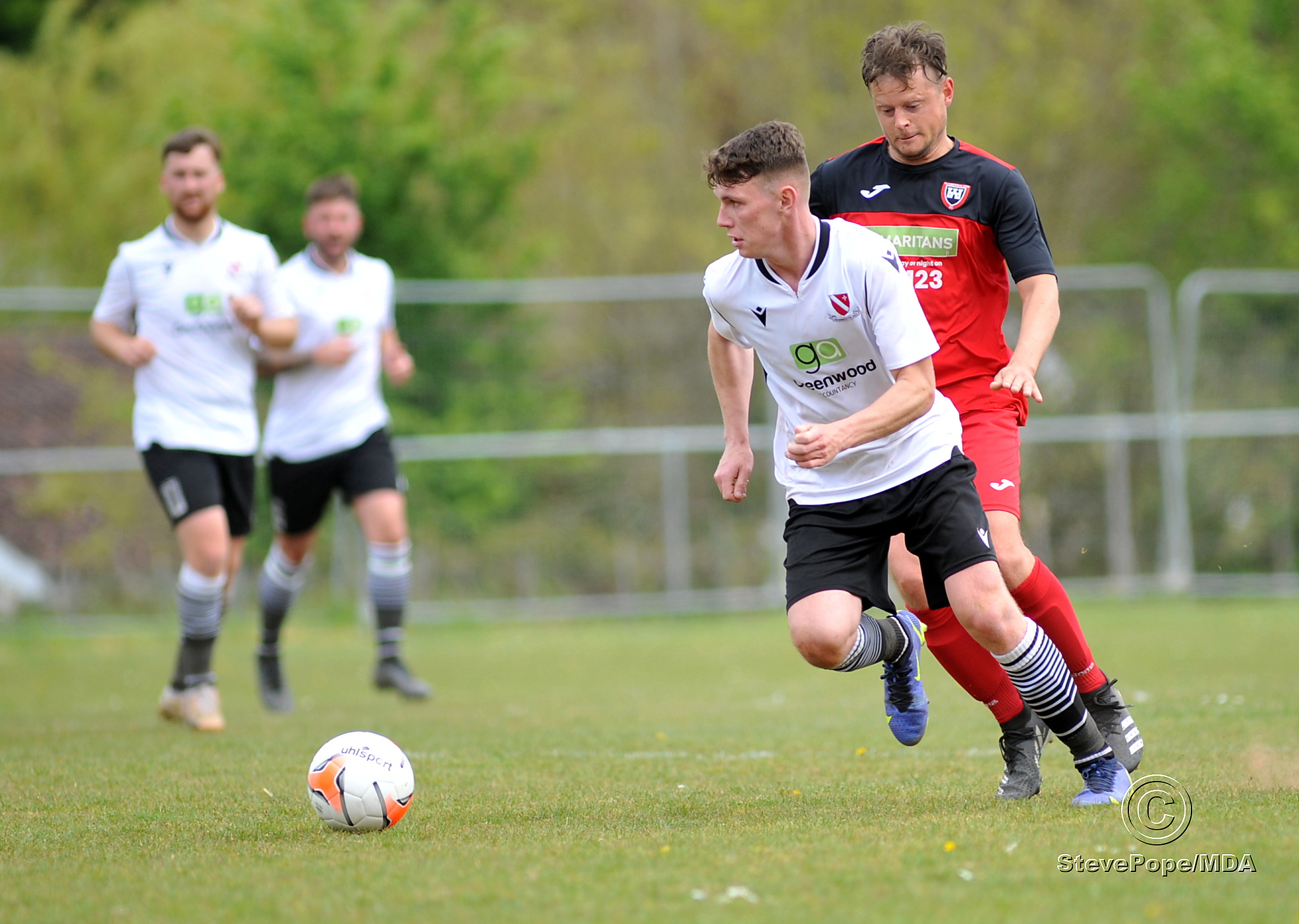Action from Teignmouth’s clash with Plymstock United on Saturday – which saw the Teigns clinch the Devon Football League South & West title.