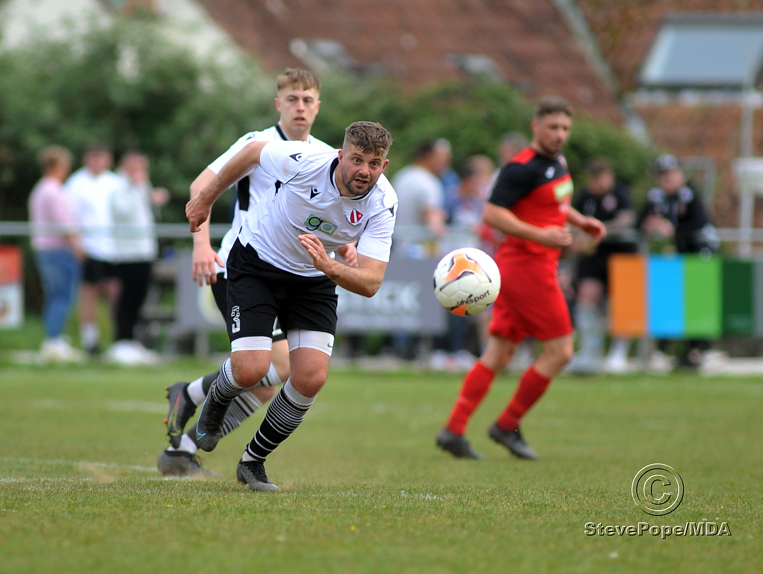 Action from Teignmouth’s clash with Plymstock United on Saturday – which saw the Teigns clinch the Devon Football League South & West title.