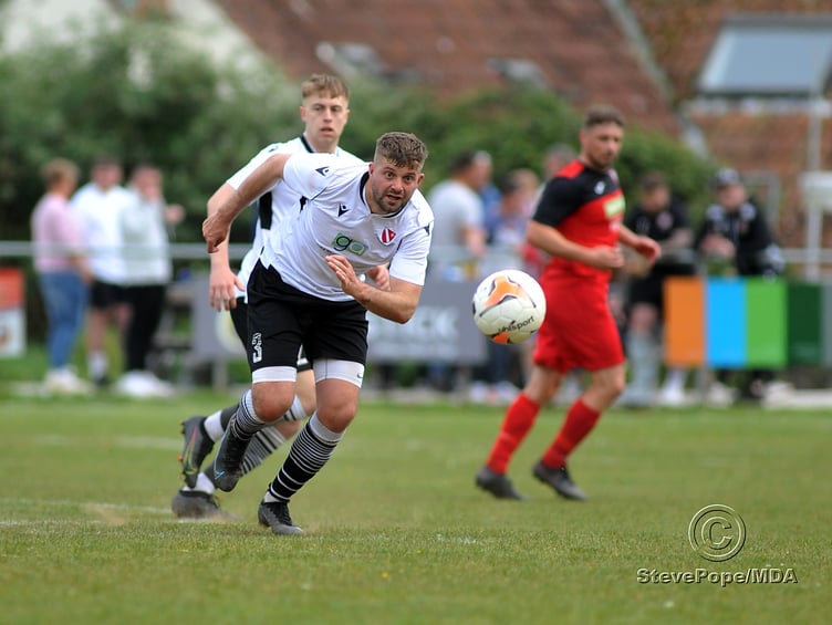 Action from Teignmouth’s clash with Plymstock United on Saturday – which saw the Teigns clinch the Devon Football League South & West title.