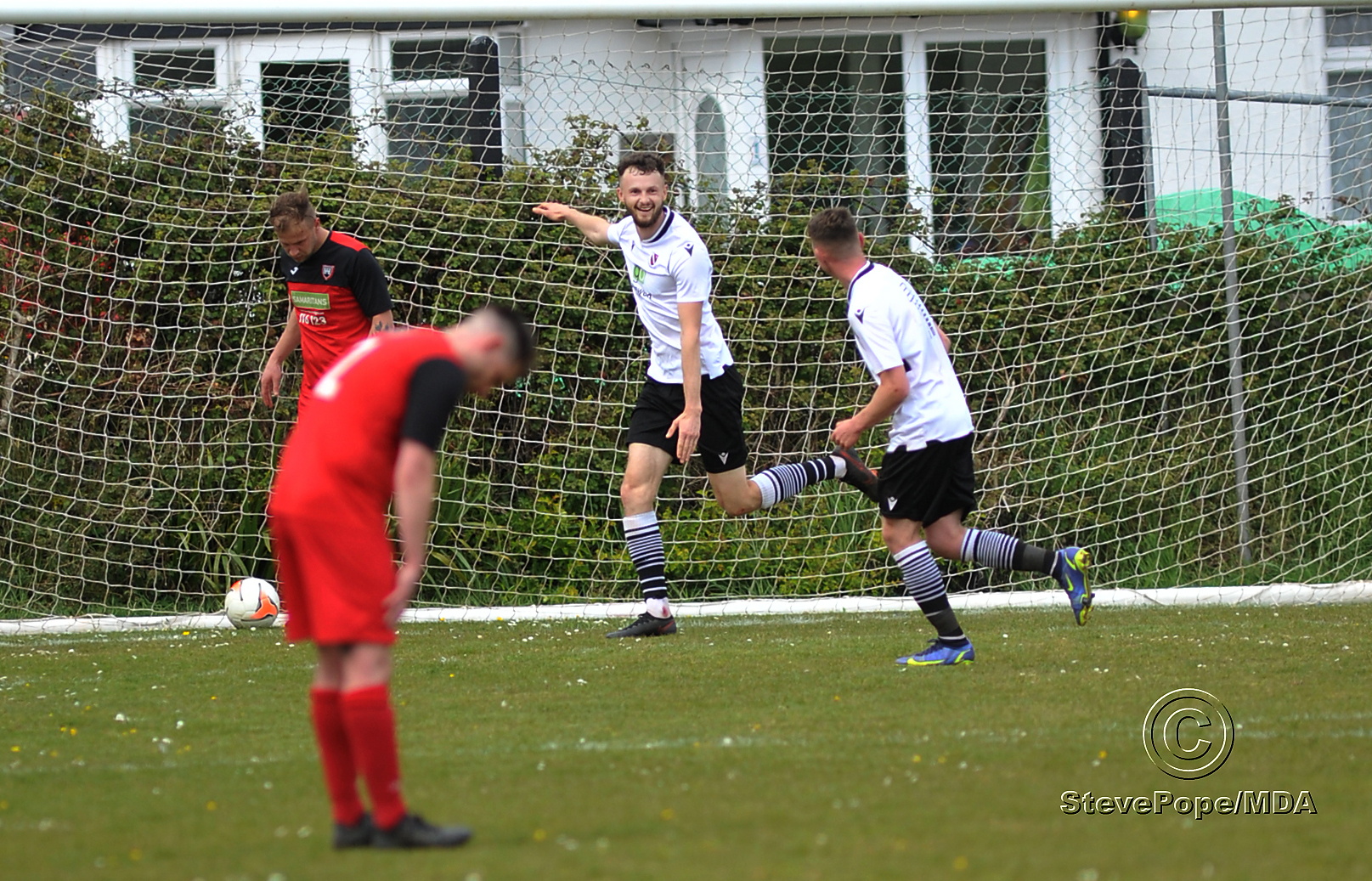Action from Teignmouth’s clash with Plymstock United on Saturday – which saw the Teigns clinch the Devon Football League South & West title.