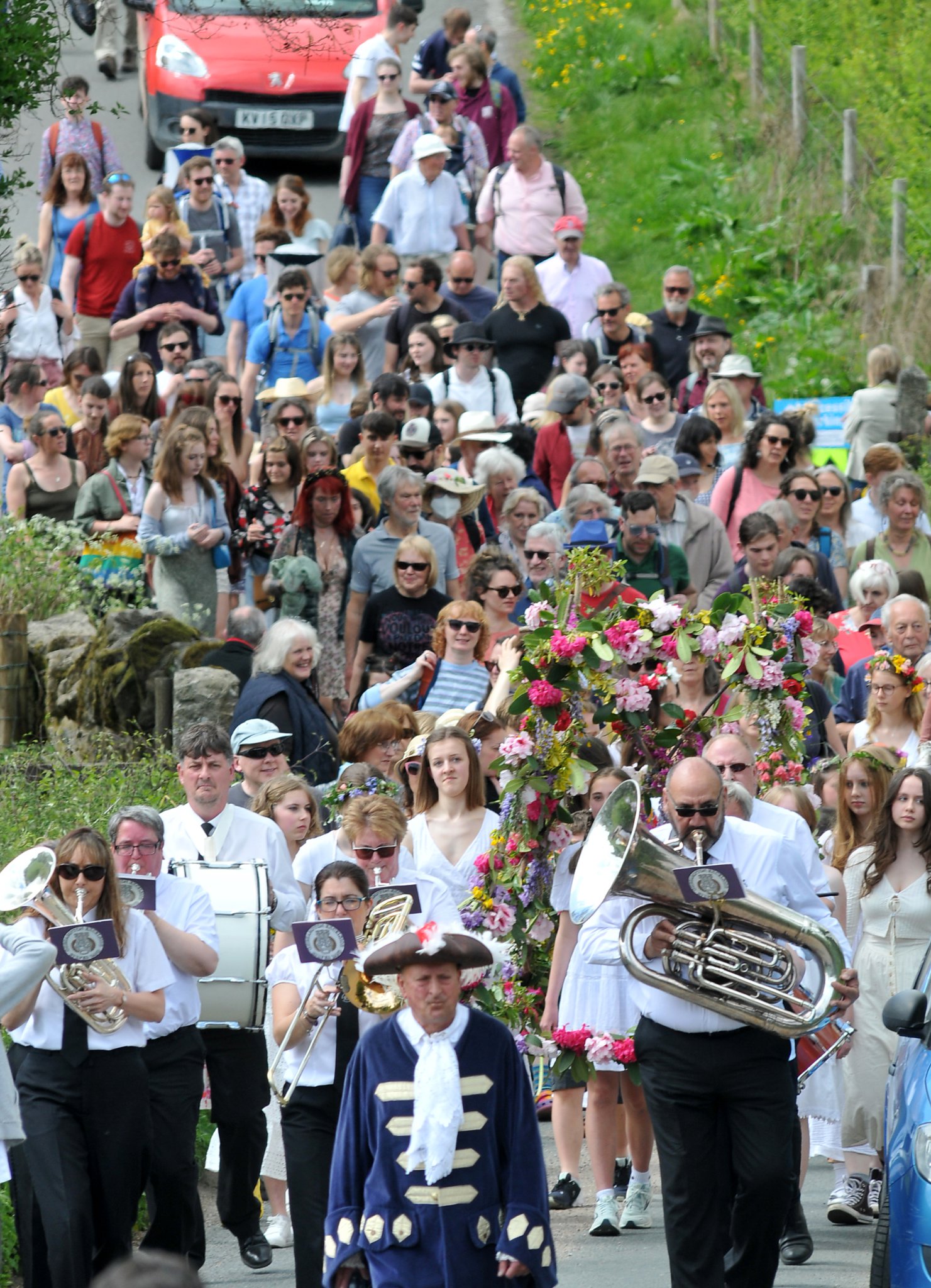 Crier Tim Wakeham leads the procession through the village.