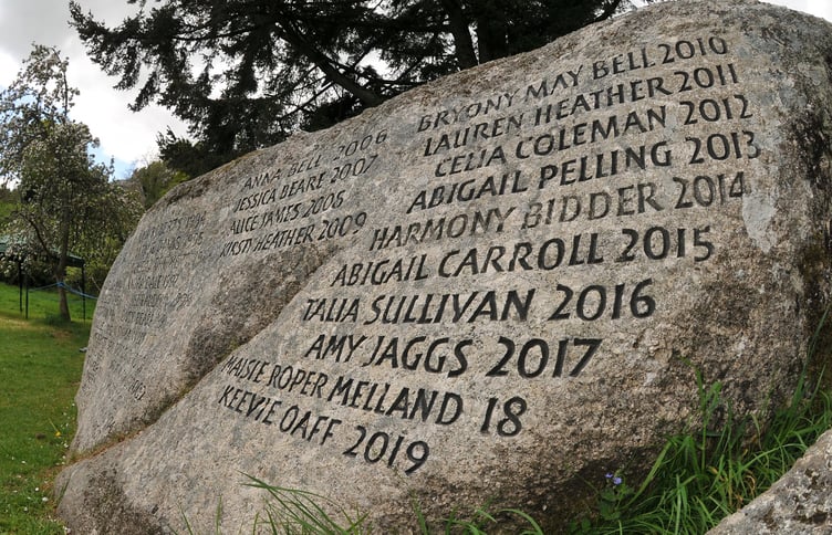 The granite rock where the May Queen coronation takes place is carved with the names of previous queens.