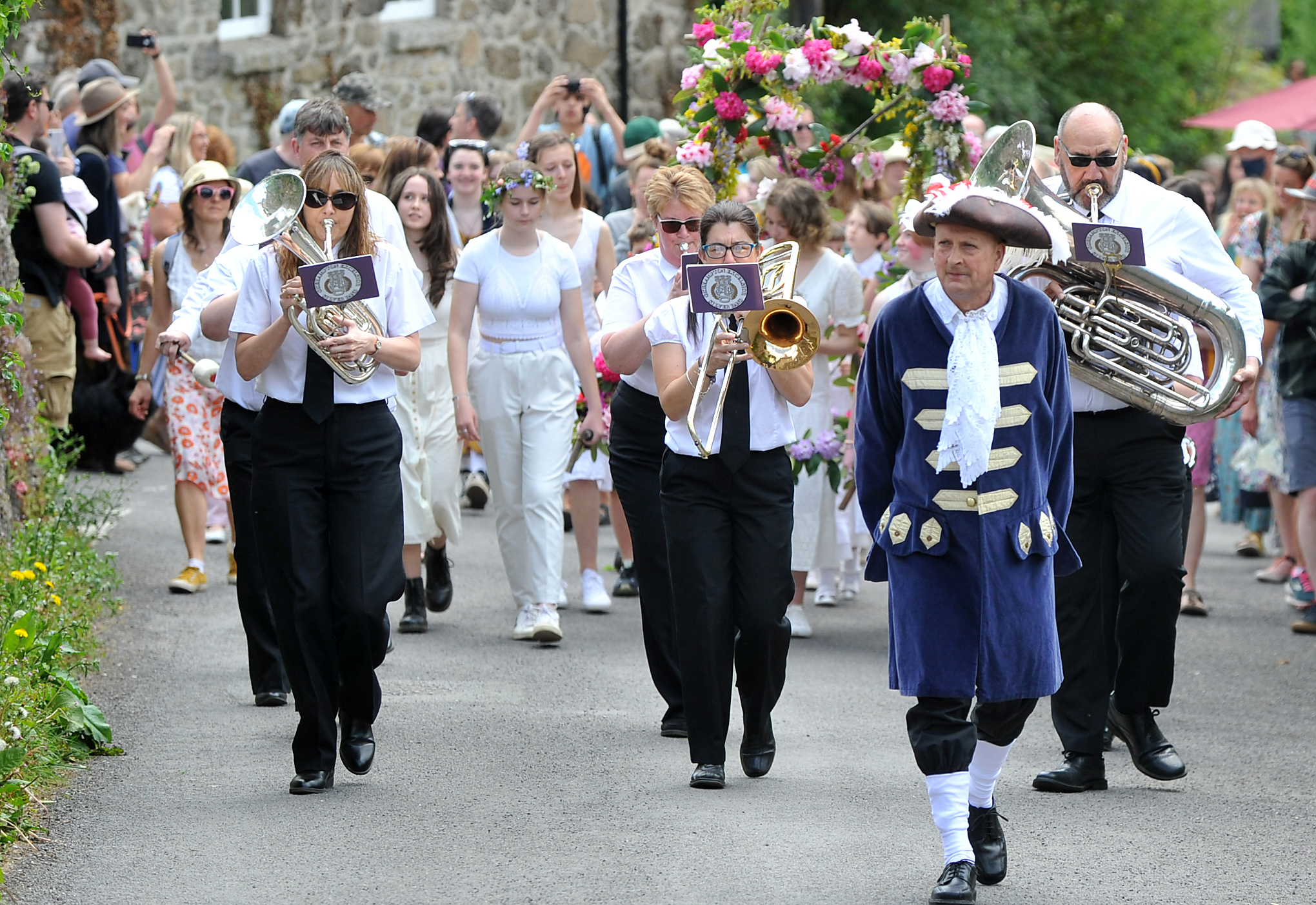 Photo: Steve Pope MDA070522E_SP013
Lustleigh May Day celebrations. Crier Tim Wakeham leads the procession around the village