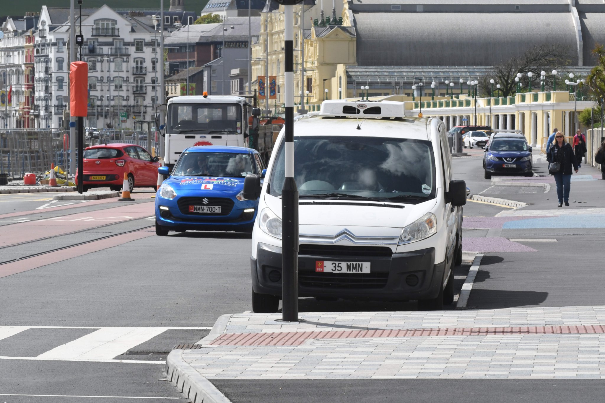 Parked cars adjoining a pedestrian crossing at the esplanade on Douglas Promenade -