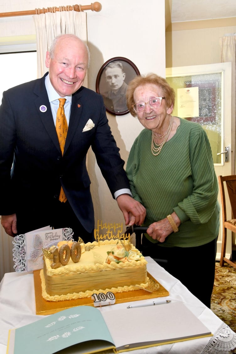 Mrs May Corlett celebrates her 100th birthday - pictured with Lieutenant Governor Sir John Lorimer