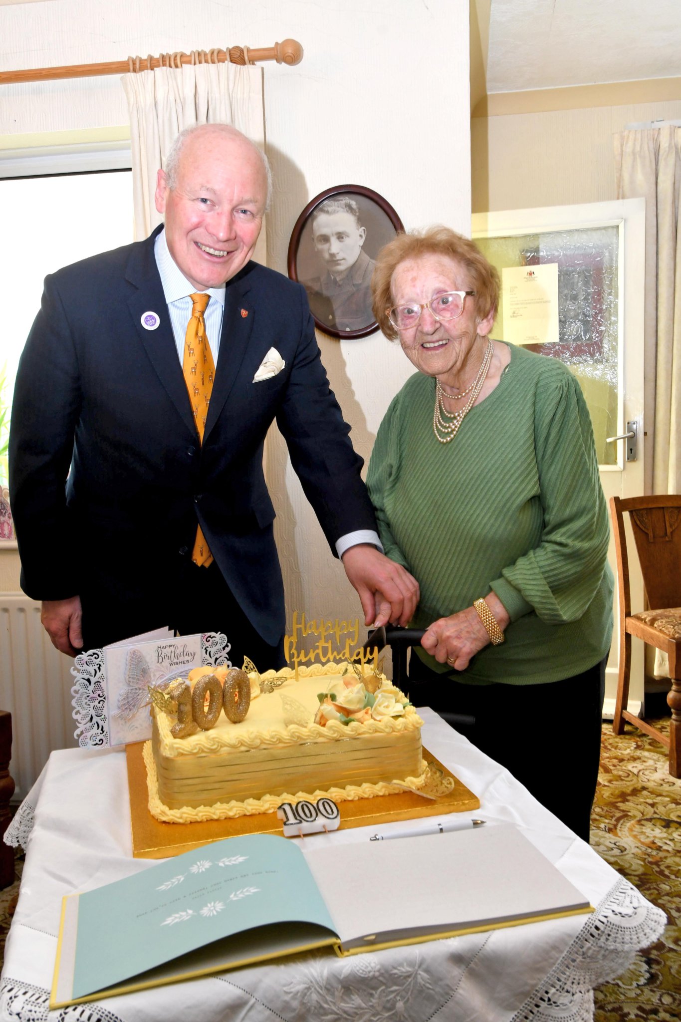 Mrs May Corlett celebrates her 100th birthday - pictured with Lieutenant Governor Sir John Lorimer