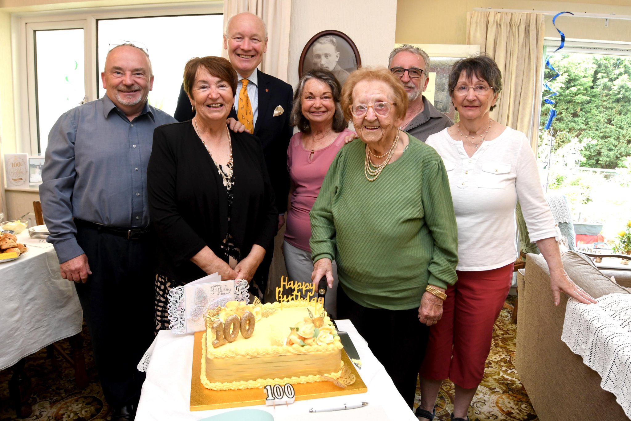 Mrs May Corlett celebrates her 100th birthday - pictured left to right: David Corlett, Cathy Cowell, Lieutenant Governor Sir John Lorimer, Elaine Shepherd, May Corlett, Graham Corlett, Lin Maxfield