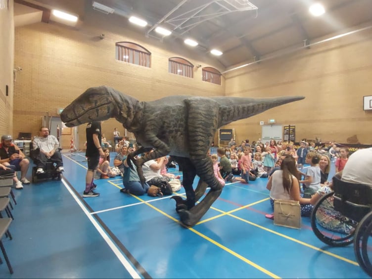 Nancy the Velociraptor prowling around the crowds