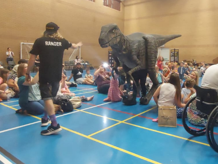 Nancy the raptor with a ranger