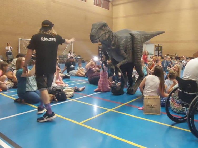 Nancy the raptor with a ranger