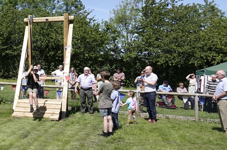 Ralph Haydn-Davies was the first to use the 30 metre zip wire at the opening by Cllr Philip Sanders (left of centre).