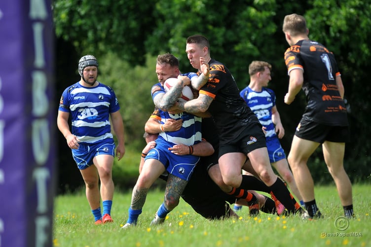 Action from the season-opening clash between Devon Sharks and Torfaen Tigers on Saturday.