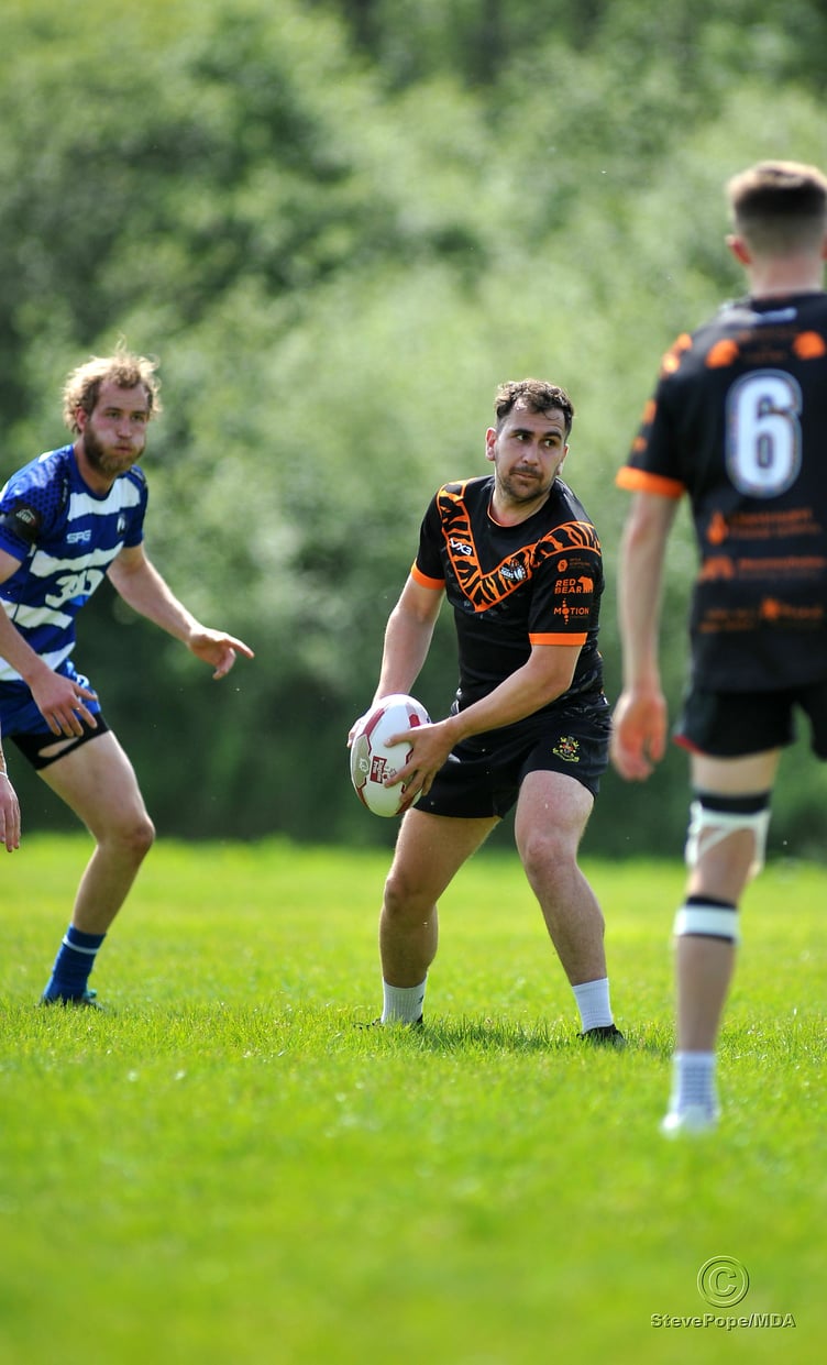 Action from the season-opening clash between Devon Sharks and Torfaen Tigers on Saturday.