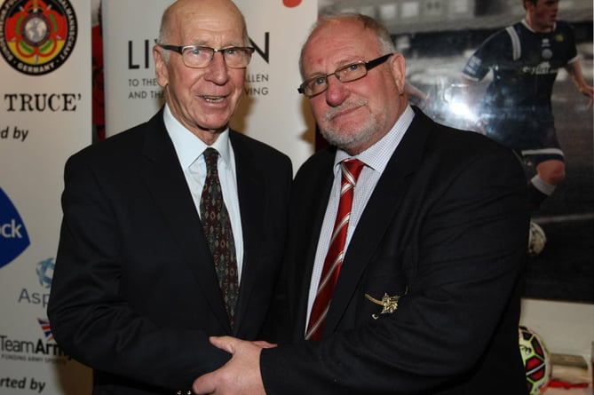 Major (Retd) Billy Thomson (right) with Sir Bobby Charlton