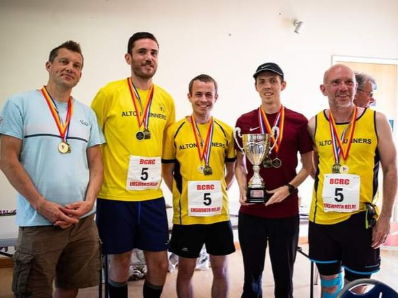 Team James Bonding proudly showing off their winners’ trophy. Picture by Doug Maclean