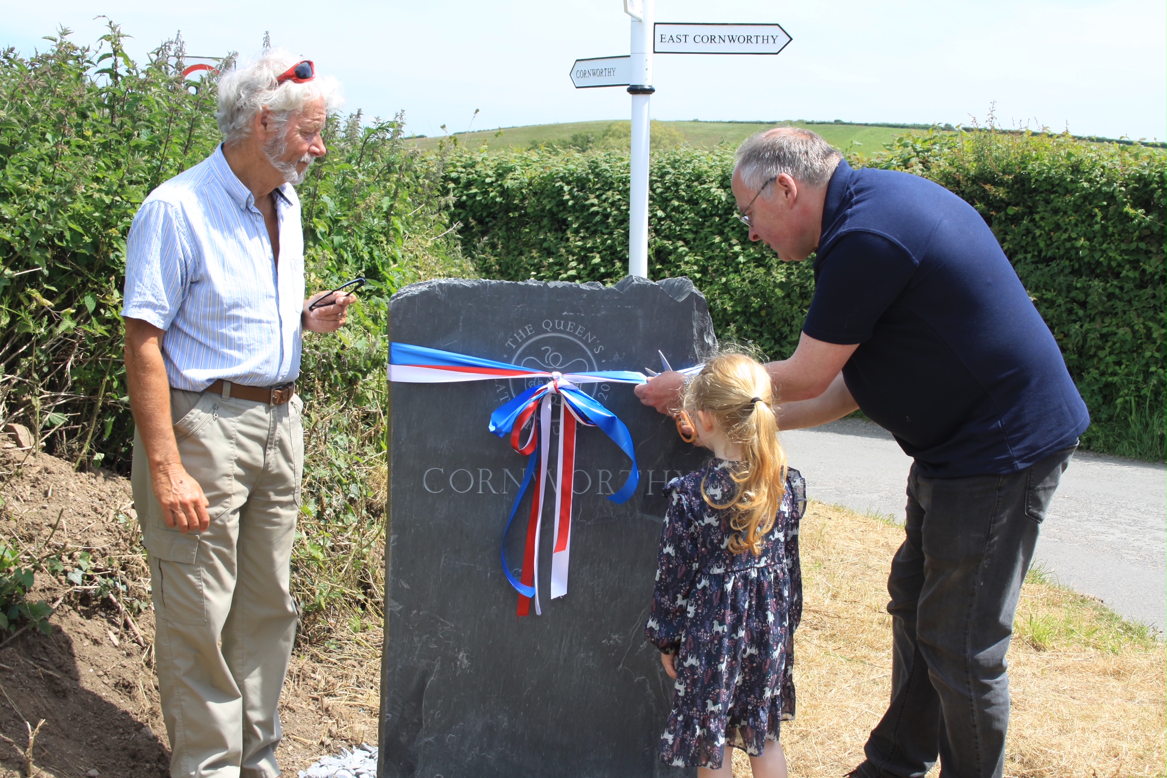 Cornworthy Jubilee stone unveiled - left to right - Tony Kirkland, chairman of Cornworthy Parish Council, Eliza and Cllr Jonathan Hawkins