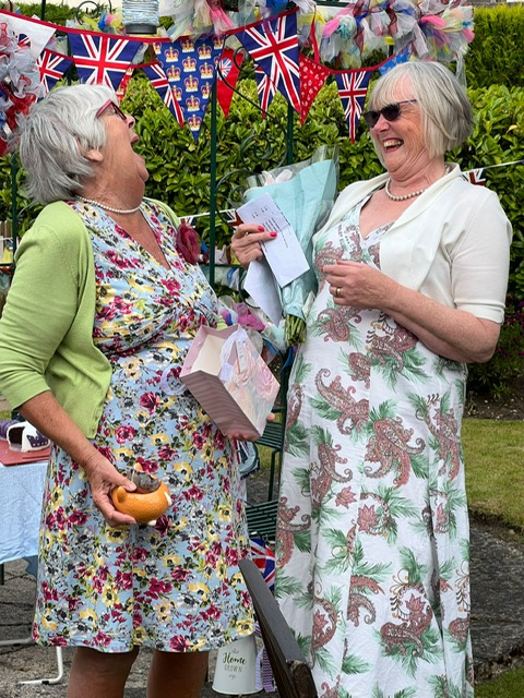 The President on the right presenting flowers to Barbara for loaning her garden and planning the Newton Abbot WI 1950s style garden party for the Platinum Jubilee. Picture: Karen Jenks
