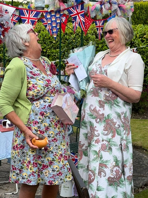 The President on the right presenting flowers to Barbara for loaning her garden and planning the Newton Abbot WI 1950s style garden party for the Platinum Jubilee. Picture: Karen Jenks
