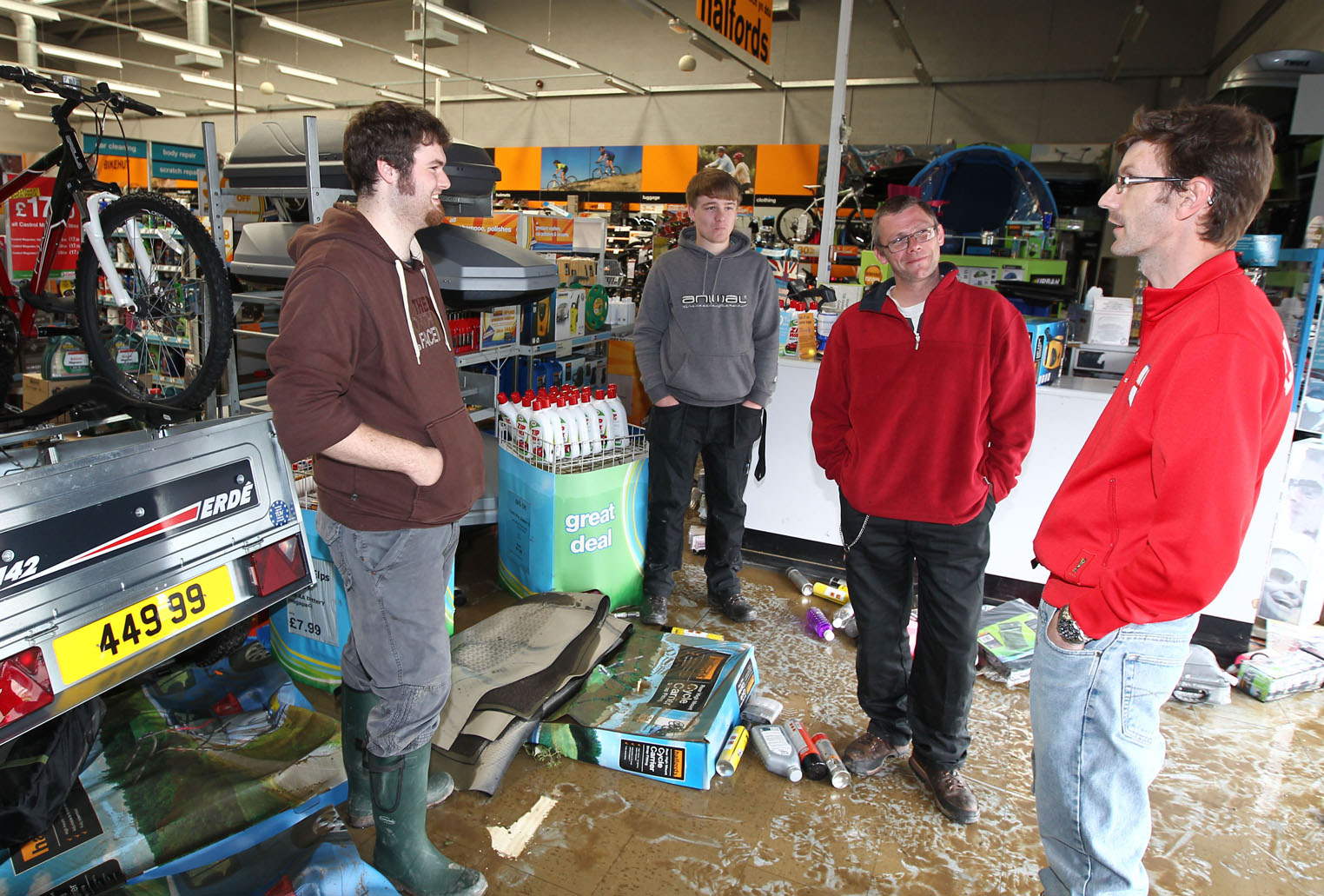 Staff at Halfords assess the damage