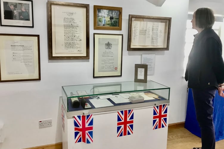 Carol Hughes looking at late husband Ted Hughes’ display at Museum of Dartmoor Life royal memorabilia exhibition