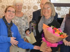 Current chair Jill Davies (left) presenting Heather Jackson with her parting gifts and a farewell card.