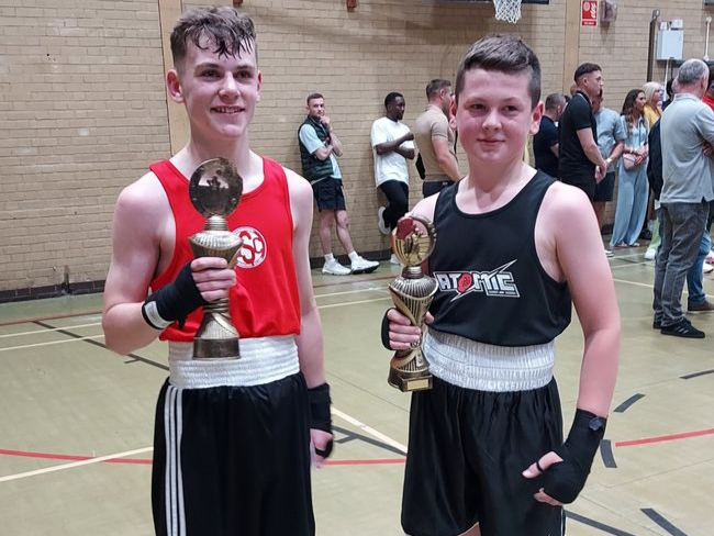 Riley Grace, right, with his Surbiton opponent