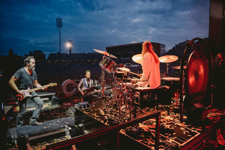 Katie Roberts on stage with the Killers in Manchester