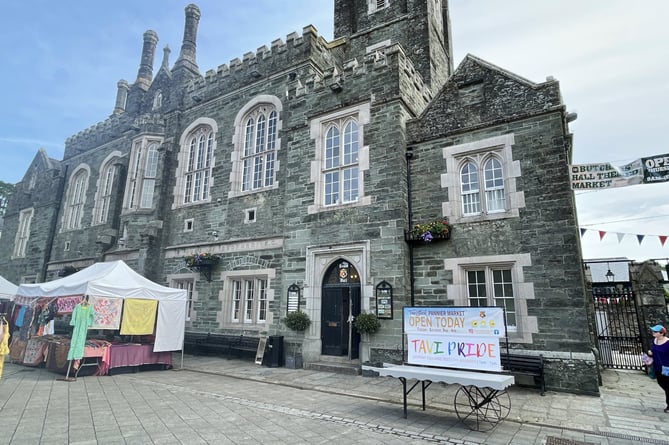 Tavistock Town Hall with Pride banner in foreground