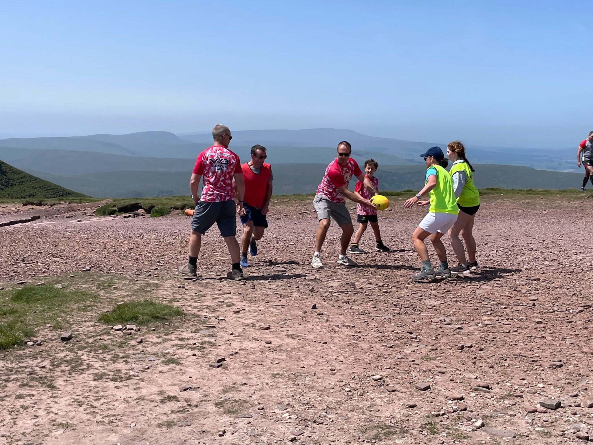 The group playing on top of Pen y Fan
