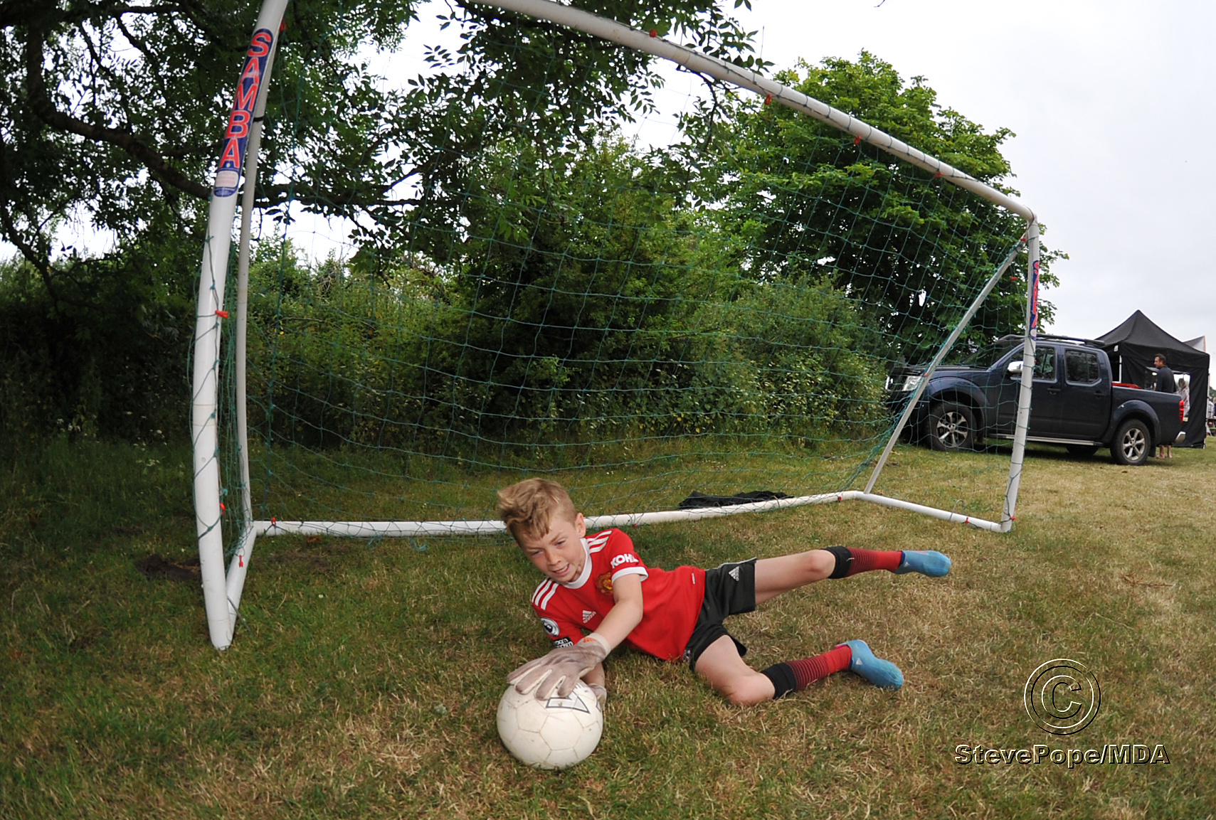 Beat the keeper. Joseph Harrity of Ogwell FC keeps another ball out of the net