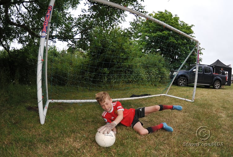 Beat the keeper. Joseph Harrity of Ogwell FC keeps another ball out of the net
