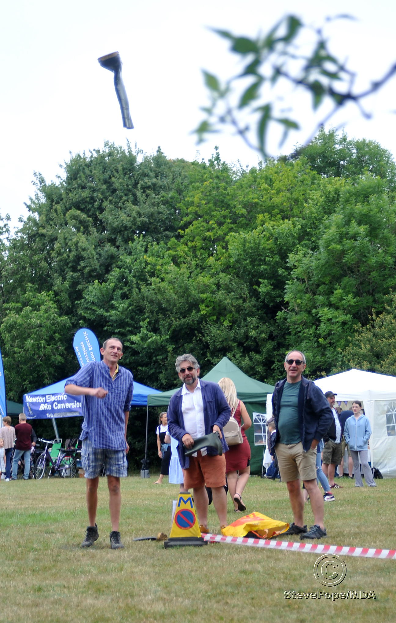 The ancient art of welly wanging. The item in flight is a wellington boot, as thrown (or wanged) by David Pratt.