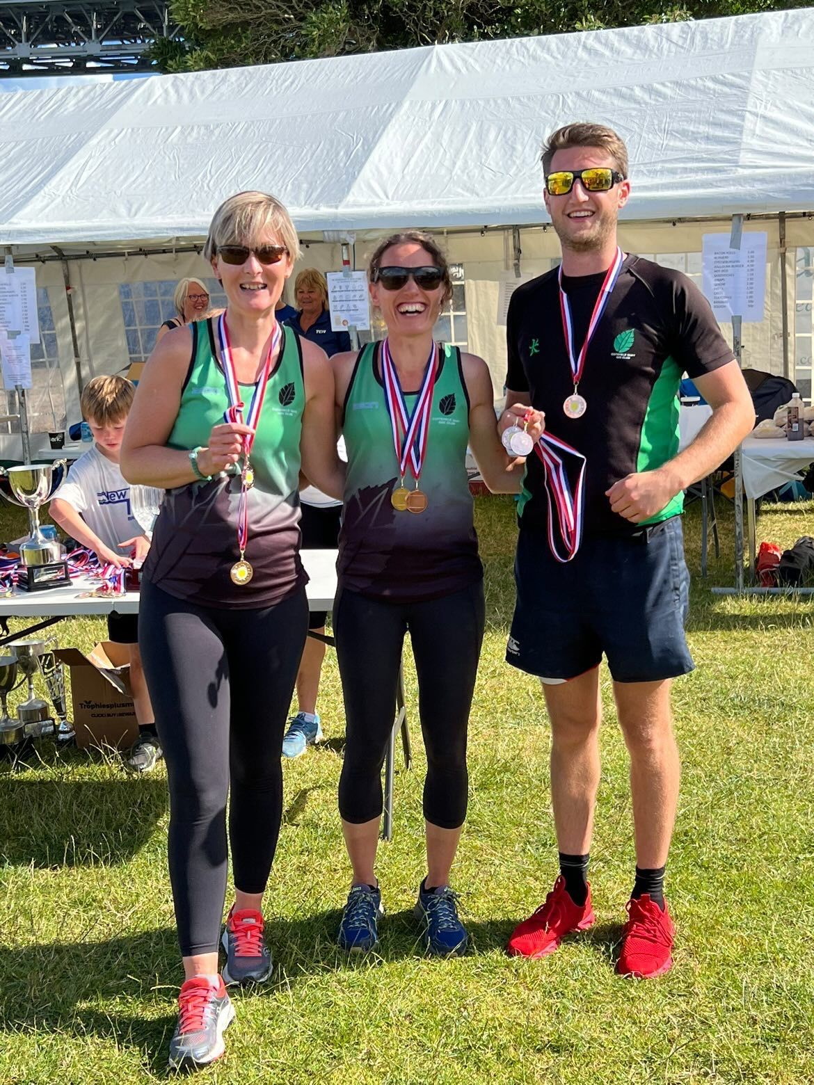 PICTURED ABOVE: The Mixed Open crew at Cotehele Quay. BELOW: Two of the Mixed Vets team, Kate and Becky, with their Cox Sam. BELOW LEFT: Full squad of the Mixed Vets crew that came third.