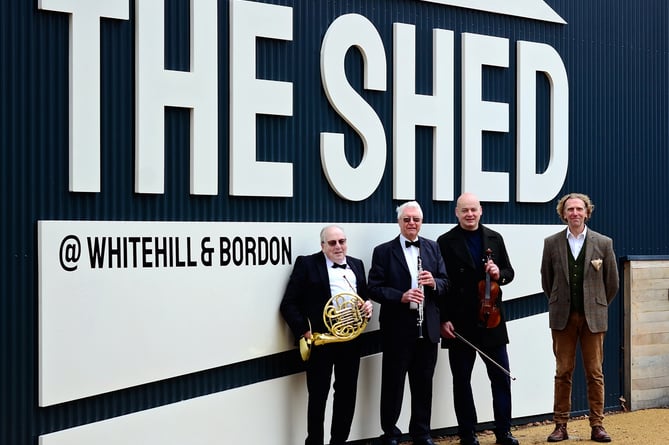 Publicity photo for A Night at the Proms in the Town Park by The Shed in Bordon on July 9th 2022. With two members of the Alton Concert Orchestra are Whitehill & Bordon Regeneration Company project lead James Child, second right, and The Phoenix Theatre and Arts Centre director Rob Allerston, far right.