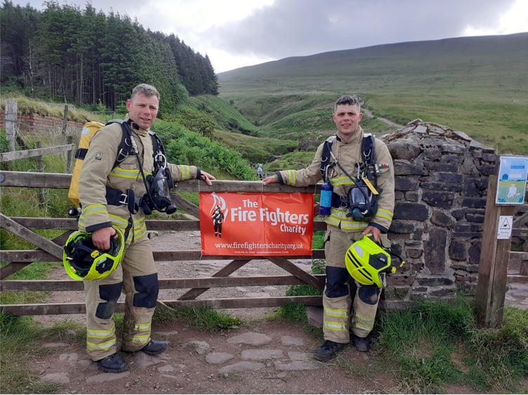 Stephen and Harry with their banner for the Fire Fighters Charity
