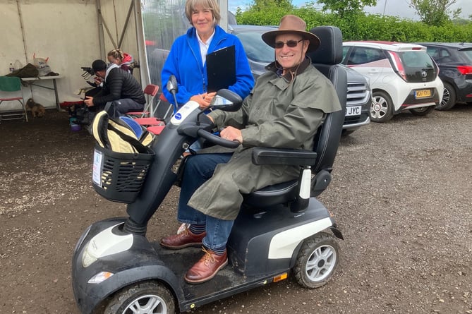 Richard Stevens gets all the information he needs to enjoy the show from Kay Yendell, manager of Newton Abbot Community Transport. Picture: Nick Knight