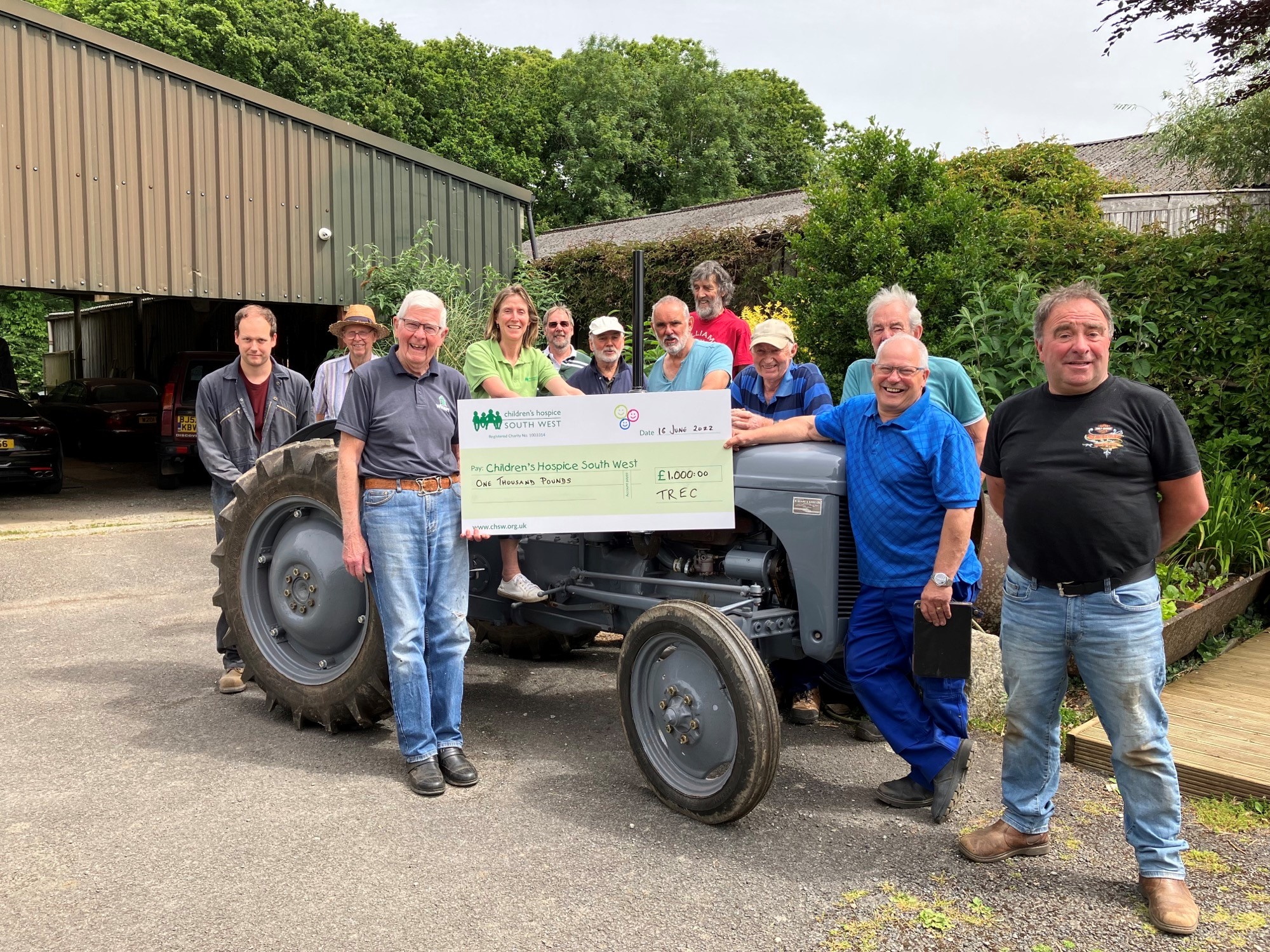 Members of Tamar Restoration and Engineering Club hand over the £1000 donation to Annabel Roberts, area fundraiser from Children’s Hospice South West following the completion and sale of the restored 1958 Nuffield DM4 tractor (pictured above right)