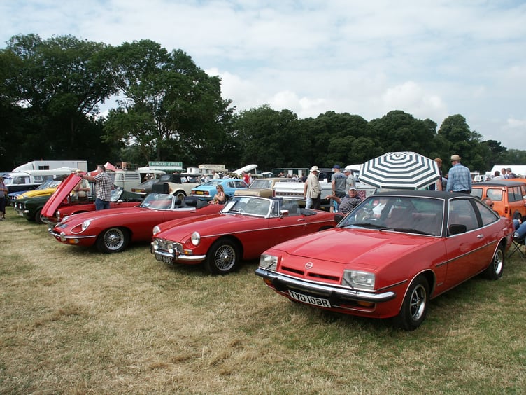 Seen as red: (left to right) a Triumph TR6, 1971 Jaguar E-Type 4.2, 1970 MGB Roadster and a 1977 Opel Manta.
