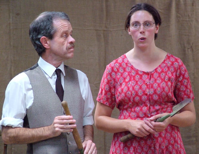 John Thompson (Rod Sharp) tells Flora Thompson (Mel White) that he has decided to move to Dartmouth in the play Flora’s Peverel by author and historian John Owen Smith.