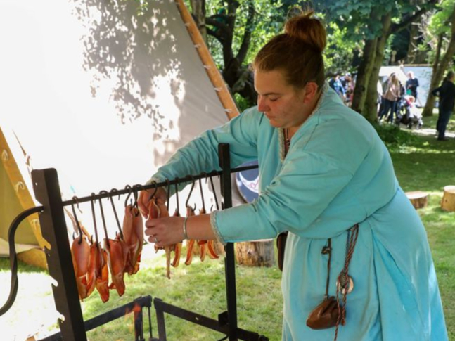 Sian Dimelow Smoking Bacon at the Viking Village during Tynwald Day 2022. Photo by Callum Staley (CJS Photography)